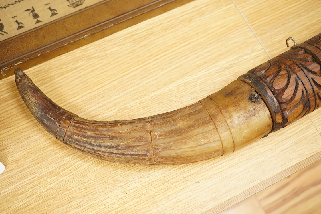 An African carved wood and cow-horn oliphant, 90cm